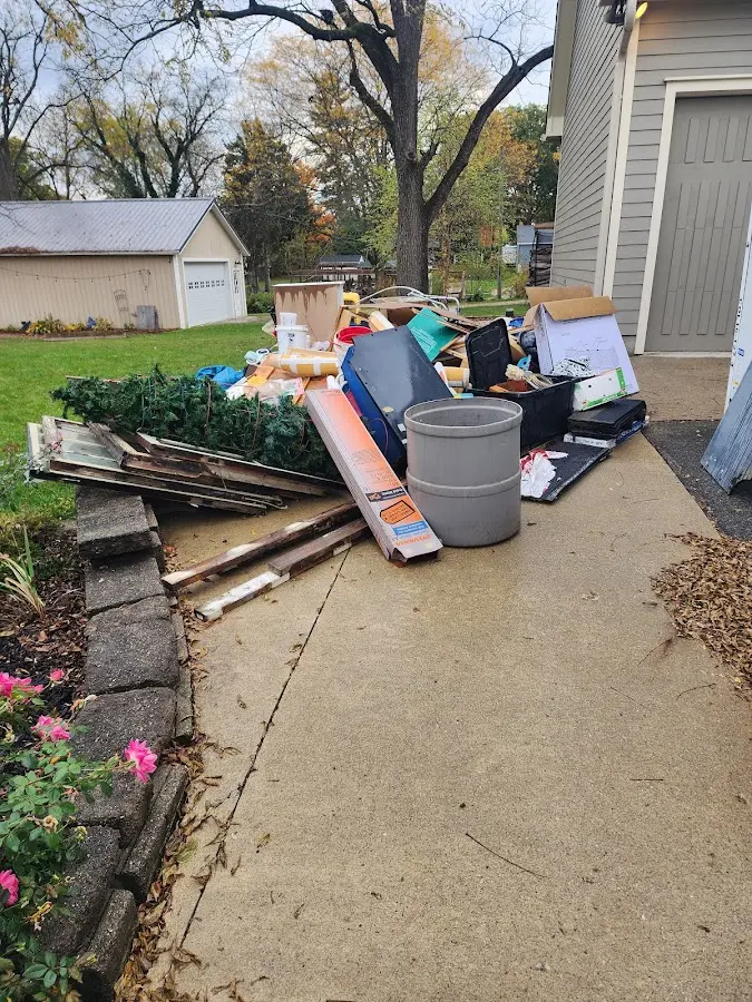 Dumpster being loaded with debris for Roofing Dumpster Rental in Sharon Hill